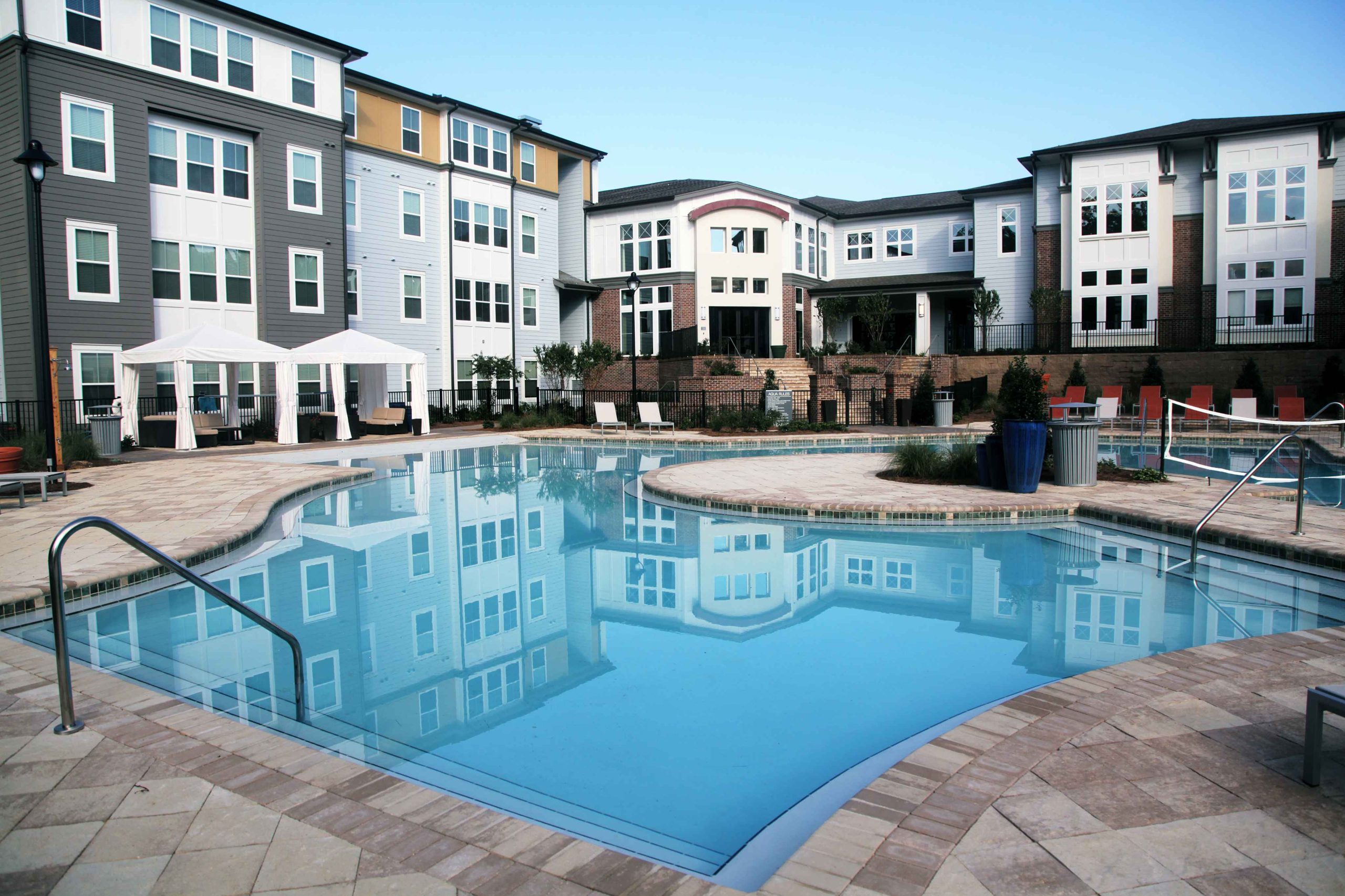 Resort-style pool with cabanas